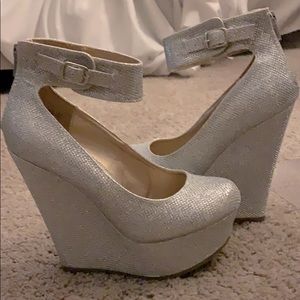Women’s size 5 1/2 closed toe silver wedges